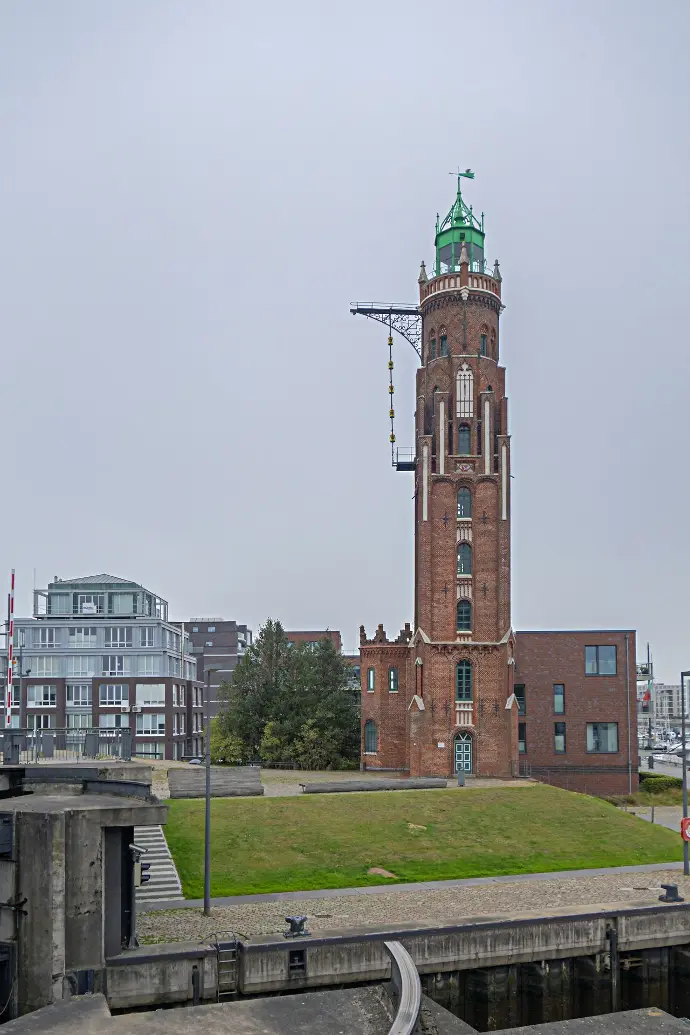 a tall tower with a clock on the top of it