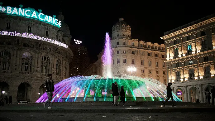 person standing near outdoor fountain