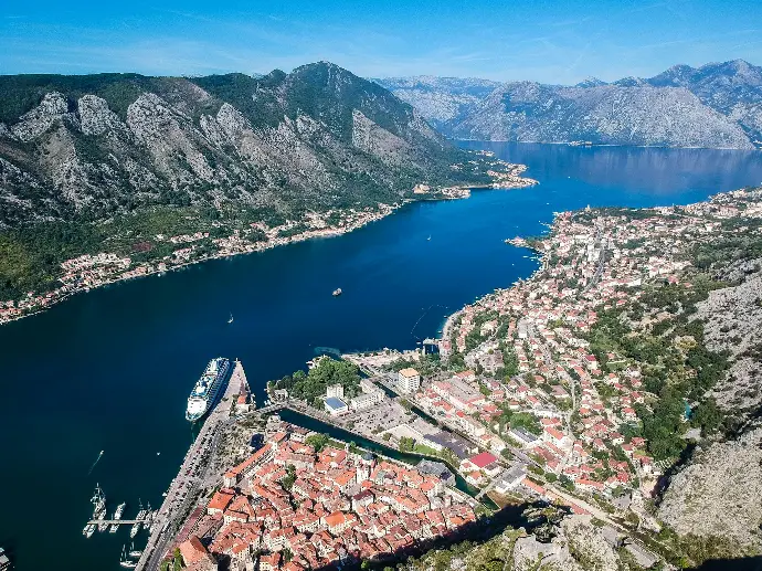 aerial view of city near body of water during daytime